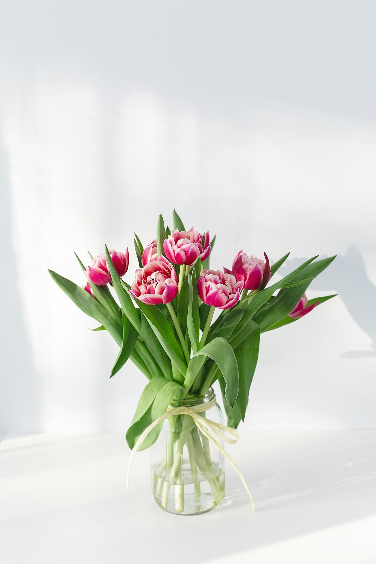 Spring wedding bouquet featuring peonies ranunculus and garden roses perfect for April and May weddings